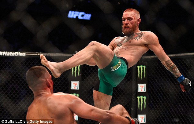 3774109D00000578-3752698-As_Diaz_stumbles_backwards_McGregor_helps_him_on_his_way_as_he_k-a-3_1471858128943