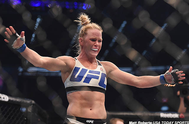 Nov 15, 2015; Melbourne, Australia; Holly Holm (blue gloves) celebrates after defeating Ronda Rousey (not pictured) during UFC 193 at Etihad Stadium. Mandatory Credit: Matt Roberts-USA TODAY Sports