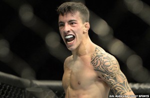 Apr 25, 2015; Montreal, Quebec, CAN; Thomas Almeida (blue) reacts after his fight against Yves Jabouin (red) (not pictured) during their bantamweight bout during UFC 186 at Bell Centre. Mandatory Credit: Eric Bolte-USA TODAY Sports