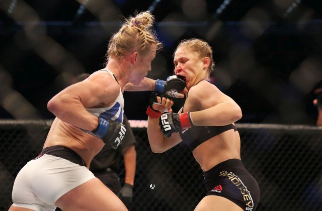 MELBOURNE, AUSTRALIA - NOVEMBER 15: Ronda Rousey of the United States (R) and Holly Holm of the United States compete in their UFC women's bantamweight championship bout during the UFC 193 event at Etihad Stadium on November 15, 2015 in Melbourne, Australia. (Photo by Quinn Rooney/Getty Images)